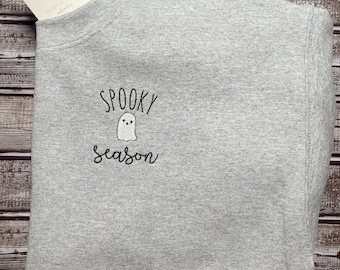 May include: Gray sweatshirt with the text "Spooky Season" and a small ghost graphic.