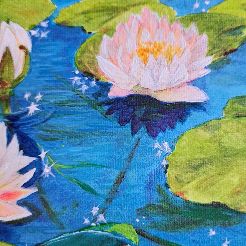 May include: A painting depicting water lilies in a pond. The water lilies are white with pink edges and yellow centres. The pond is blue with green lily pads. The painting is executed in a loose, impressionistic style.