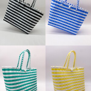 May include: Four striped tote bags in different colors: black and white, blue and white, green and white, and yellow and white.
