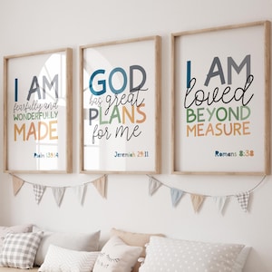 May include: Three framed prints with inspirational quotes and bible verses. The prints are in a light wood frame and have a white background with colourful text. The quotes are "I am fearfully and wonderfully made", "God has great plans for me", and "I am loved beyond measure".