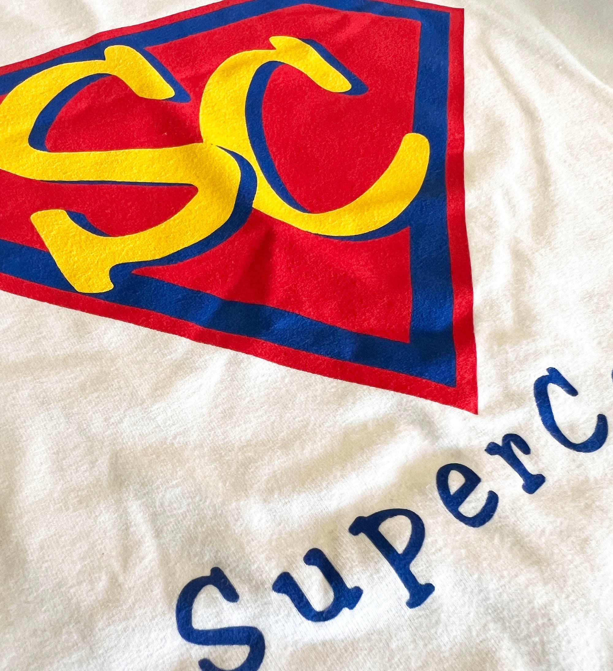 Super Core Top Most Comfortable Womens White Cap Sleeve Tee With "Super Core" Graphic Longer Length White Graphic Cap Sleeve Tee Fits M-L