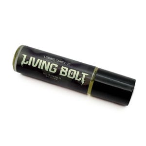 May include: A roll-on perfume oil bottle with a black label featuring the text "LIVING BOLT" in white and a lightning bolt graphic. The bottle also includes the text "LUMINIS CANDLE CO" and "ROLL-ON PERFUME OIL 0.33 OZ / 10 ML". The cap is black.