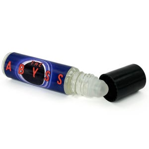 May include: A clear glass roll-on bottle with a blue label featuring the word "ABYSS" in red letters. The bottle is lying on its side with the black cap removed, revealing the rollerball applicator.