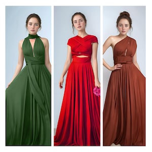 May include: Three elegant floor-length dresses in different colors: olive green, bright red, and a warm brown. Each dress features a unique design, including halter necklines, criss-cross bodices, and one-shoulder styles. The dresses are made of flowing fabric.