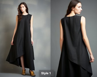 May include: A black sleeveless dress with a high low hemline. The dress has a simple, elegant design and is perfect for a variety of occasions. Style 1.
