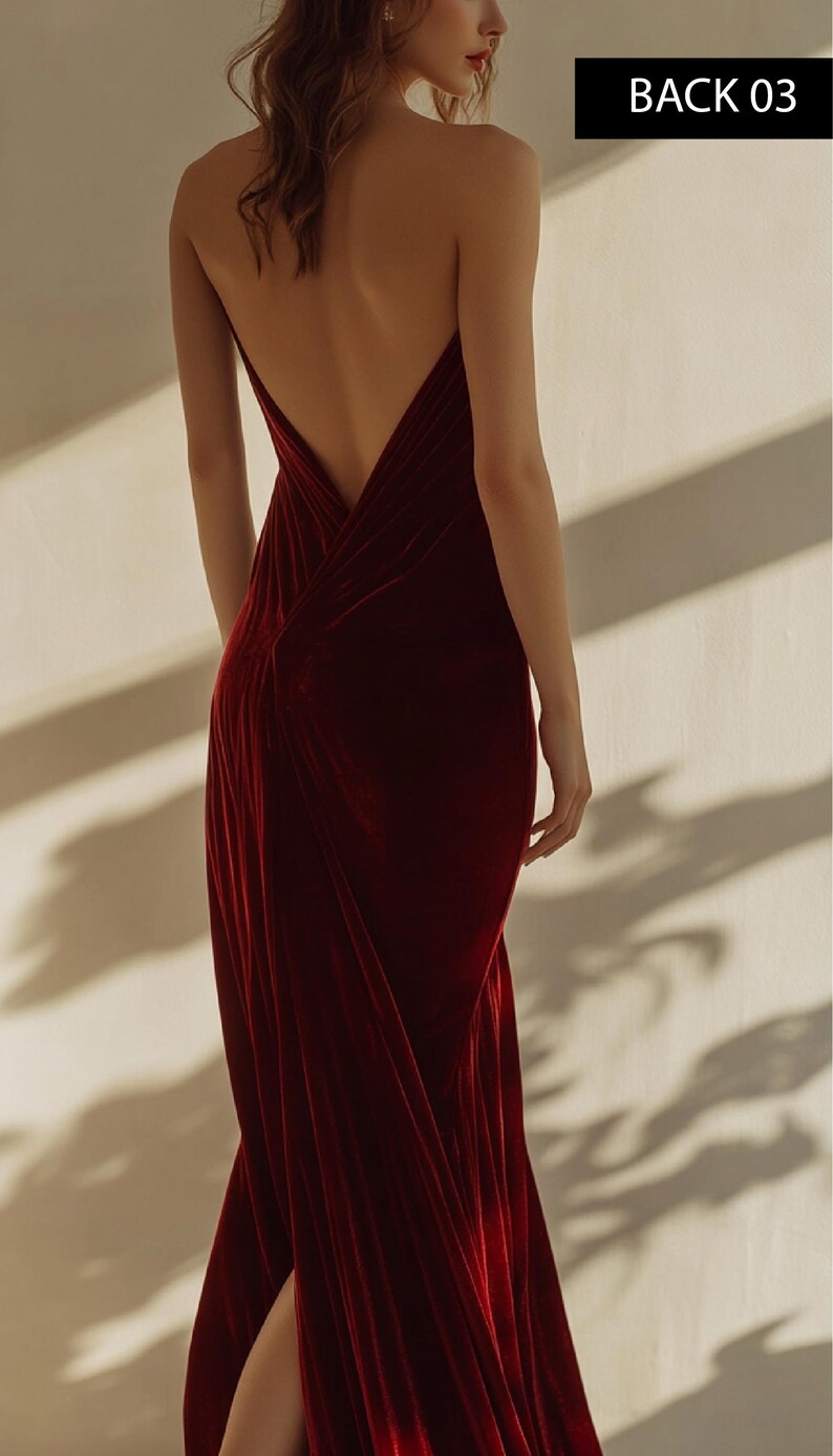 May include: A woman wearing a deep red velvet maxi dress with a low back and a slit in the skirt. The dress has a draped design and is fitted through the bodice.