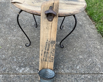 Texas bottle opener on Bourbon Barrel head. Bottle opener with basket.