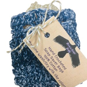 May include: Hand crocheted soap saver bag made of 100% cotton in blue and white. The bag is tied with twine and has a tag that reads "Hand Crocheted Soap Saver Bags 100% Cotton Maine Wash/Dry with like colors" and a raven logo.