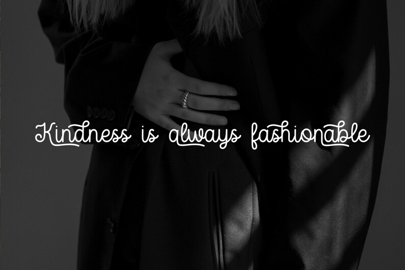 May include: Black and white photo of a person wearing a black jacket with the text "Kindness is always fashionable" in white.