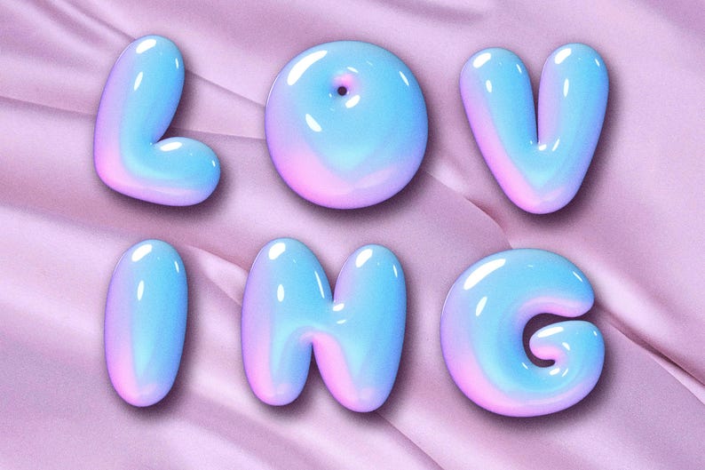 Puede incluir: Seis letras de burbujas 3D que deletrean la palabra "LOVING" en un degradado de tonos azules y rosas. Las letras son brillantes y parecen flotar sobre un fondo de tela rosa suave.