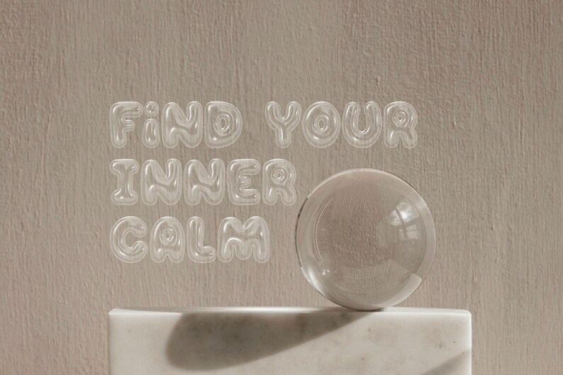 May include: A clear glass sphere sits on a white marble pedestal against a beige background. The words "FIND YOUR INNER CALM" are written in a clear, bubbly font.