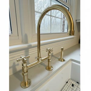 Unlacquered Solid Brass Bridge Kitchen Faucet with Side Sprayer.