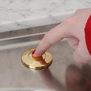 May include: A rustic wooden sign with the text "Welcome to our home" in white lettering. The sign features a distressed finish and a simple, inviting design, perfect for front door decor.