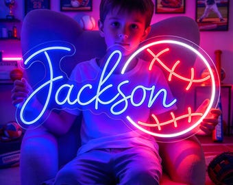 May include: A custom LED neon sign featuring the name Jackson in blue script lettering next to a red and white baseball graphic. The sign is mounted on a clear acrylic backing and emits a bright glow, displaying the name and sports theme.