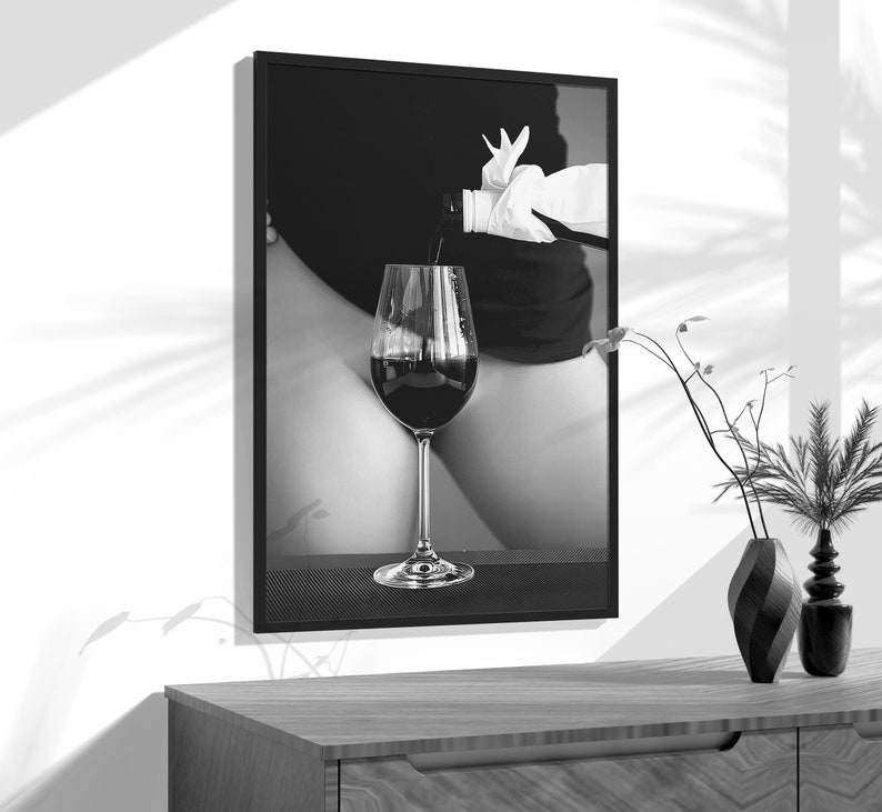 a black and white photo of a glass of wine