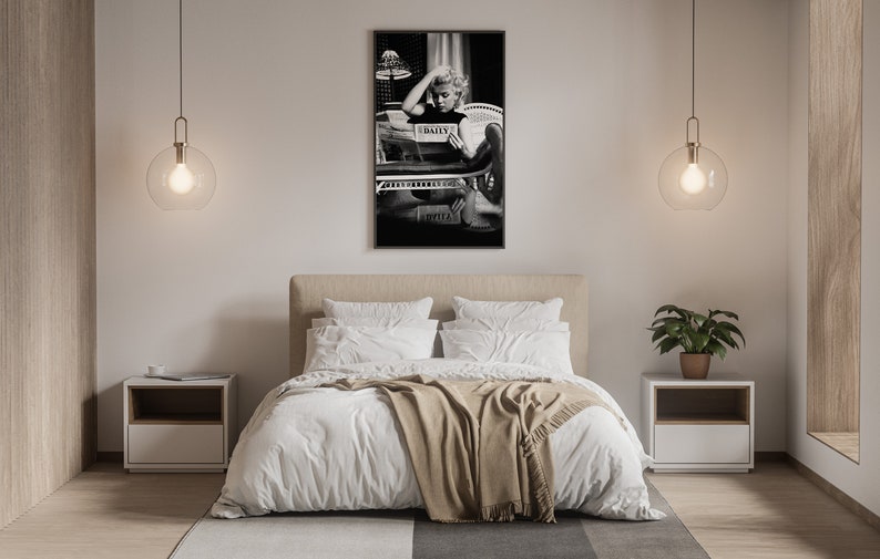 a bedroom with a bed and a painting on the wall