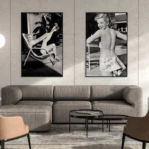 a living room with two pictures on the wall