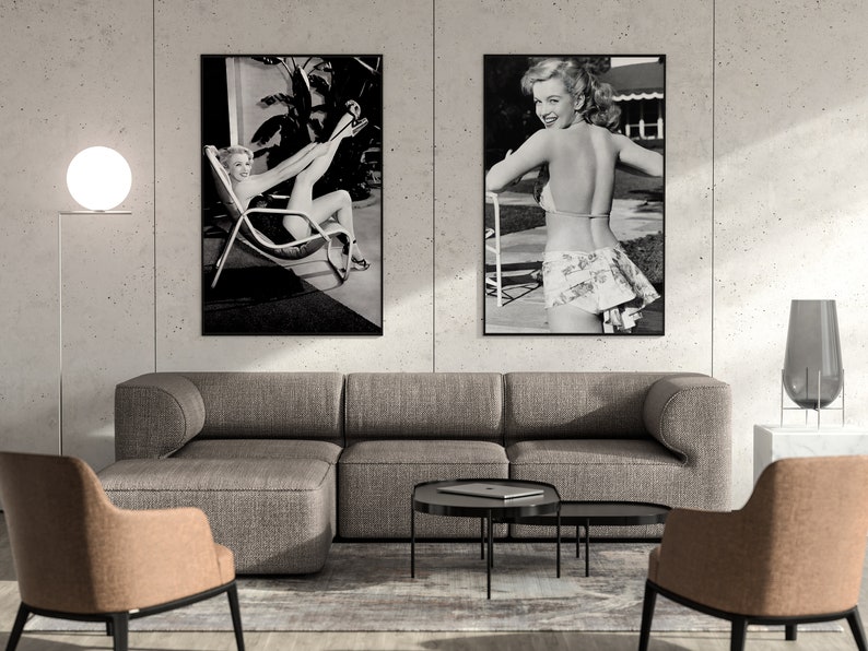 a living room with two pictures on the wall