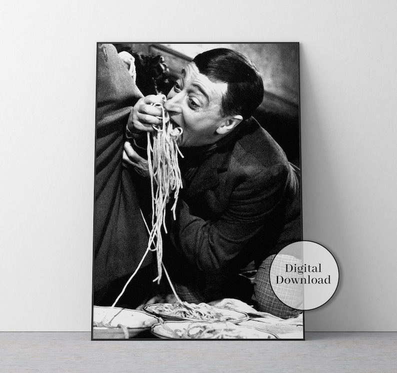 a black and white photo of a man eating spaghetti