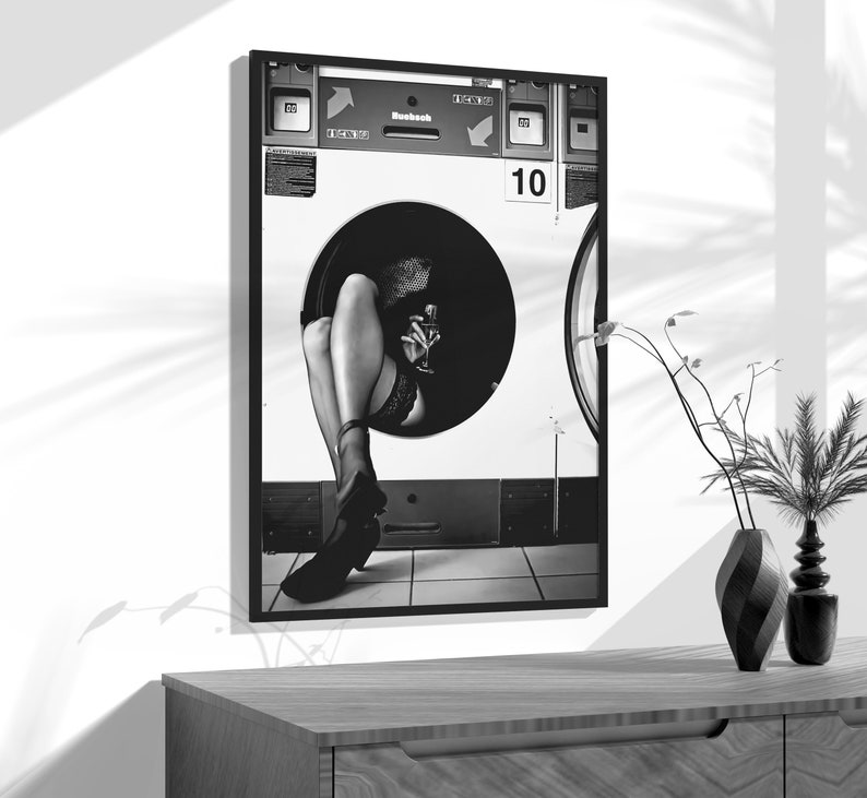 a black and white photo of a woman's legs in a washing machine