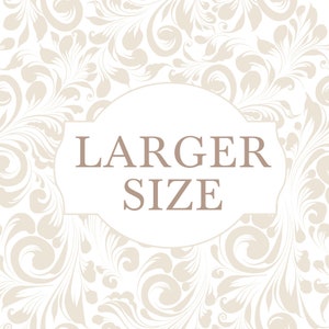 May include: A white background with a beige floral pattern. A white oval with a beige border contains the text "LARGER SIZE" in brown.