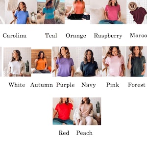 May include: A collection of 18 different colored t-shirts, each worn by a different model. The colors include black, clay, carolina blue, teal, orange, raspberry, maroon, mustard, sand, grey, white, autumn, purple, navy, pink, forest, heather, mauve, red, and peach.