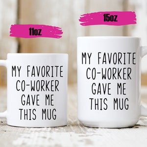 May include: Two white ceramic mugs with black text that reads "My favorite coworker gave me this mug". The mug on the left is 11oz and the mug on the right is 15oz.