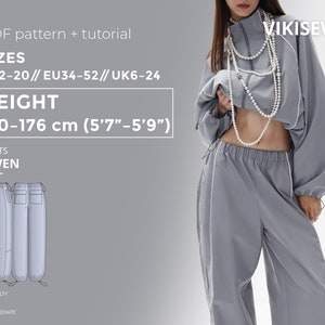 May include: A grey pants sewing pattern with white trim. The pattern is for sizes US 2-20, EU 34-52, and UK 6-24. The pattern is for a height of 5'7" to 5'9" (170-176 cm). The pattern is labelled "GWEN" and is rated as intermediate difficulty.