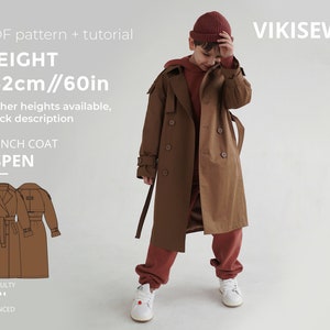 May include: A brown trench coat with a belt and buttons. The coat is for a child and is 60 inches tall. The text "TRENCH COAT ASPEN" is on the image. The text "HEIGHT 152cm//60in" is also on the image.