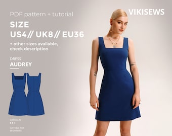 May include: A blue sleeveless dress with a square neckline. The dress is shown on a model and is available in sizes US4, UK8, and EU36. The dress is called "Audrey" and is suitable for beginners to sew.