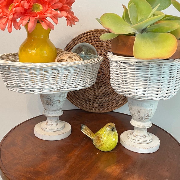 White basket pedestal riser, distressed whitewashed wood tones. Rattan top, repurposed wood base