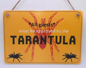 All Guests Must Be Approved By the Tarantula sign