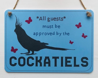 All Guests Must Be Approved By the Cockatiel sign
