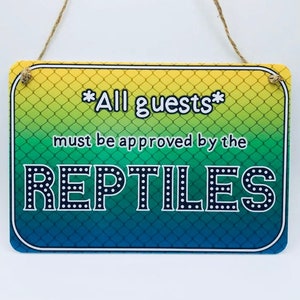 All Guests Must Be Approved By the Reptiles sign