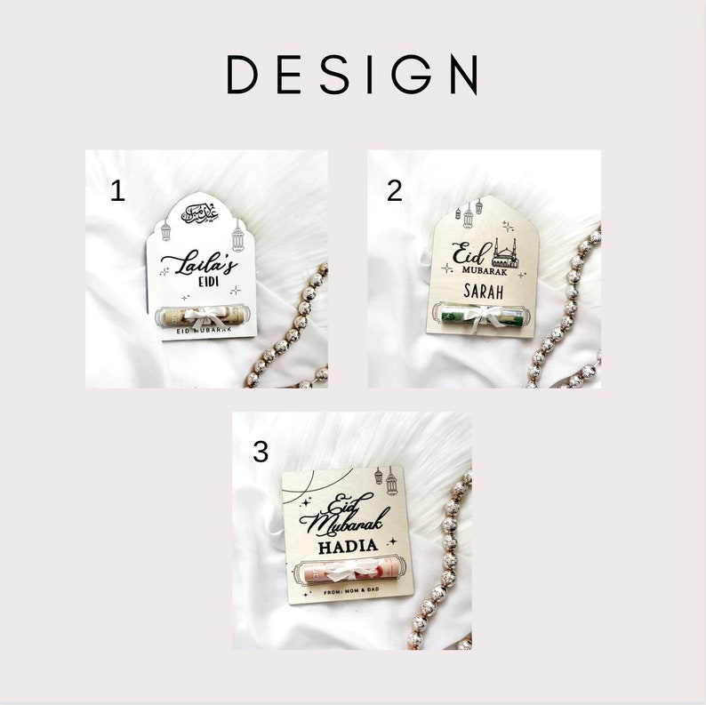 May include: Three different designs for a wooden card with a rolled up bill inside. The card has a decorative design with a mosque and lanterns. The text on the card says "Eid Mubarak" and includes a name. The first card says "Laila's Eidi", the second card says "Eid Mubarak Sarah", and the third card says "Eid Mubarak Hadia".