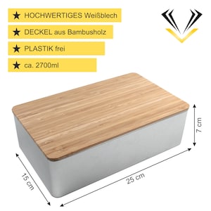 Datenblatt einer Keksdose mit den Abmessungen 25 cm x 15 cm x 7 cm. Hergestellt aus hochwertigem Weißblech und einem Deckel aus Bambusholz. Plastikfrei mit einem Fassungsvermögen von ca. 2700 ml