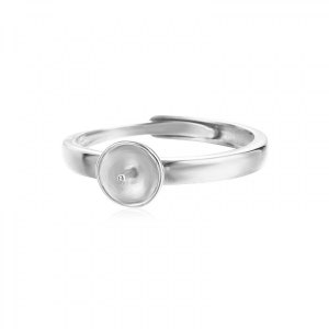 May include: A silver ring with a round, white, pearl-sized bezel. The ring is adjustable and can be worn on any finger.