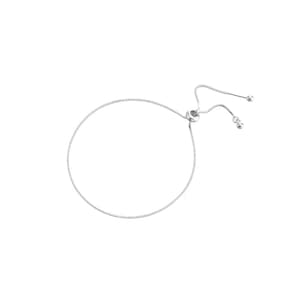 May include: A silver adjustable bracelet with a sliding clasp. The bracelet is made of a delicate chain.