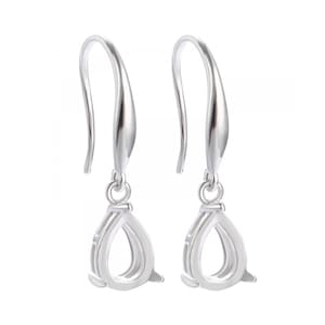 May include: A pair of silver earring findings with a teardrop-shaped bail. The findings have a hook closure.