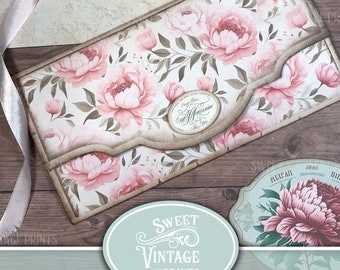 May include: A junk journal folio kit with a vintage aesthetic, showcasing a pink and white peony floral pattern. The design includes decorative labels and a ribbon, with the text "Sweet Vintage Prints" and "Vintage Peonies".