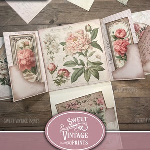 Op de afbeelding: Een vintage-stijl junk journal folio met een roze en groen bloemenontwerp. De folio is gemaakt van papier en heeft verschillende zakken en kleppen. De tekst "Sweet Vintage Prints" is gedrukt op de voorkant van de folio. De tekst "Vintage Peonies Folio" en "Junk Journal Folio" is gedrukt op de onderkant van de folio.