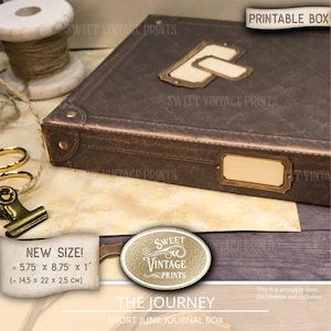 May include: A brown rectangular box with a textured surface, featuring metal-look corner accents and blank label plates on the top and side. The box includes text stating a size of 5.75 inches by 8.75 inches by 1 inch and the label PRINTABLE BOX.