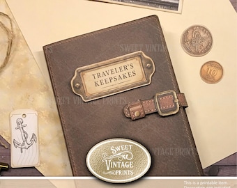 May include: A brown rectangular wallet featuring a metal label plate with the text TRAVELER'S KEEPSAKES, a buckled strap closure, and an oval logo badge reading SWEET VINTAGE PRINTS. The wallet is displayed alongside a small anchor tag and coins.