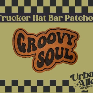 May include: A brown and black patch with the words "GROOVY SOUL" in a retro font. The patch is designed for trucker hats and features the text "Trucker Hat Bar Patches" and the "Urban Alley design co." logo.