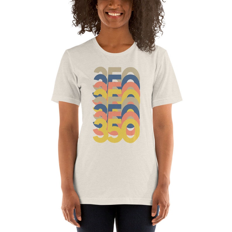 May include: A white t-shirt with a retro-style graphic of the number 350 repeated in different colors, including yellow, blue, and pink.