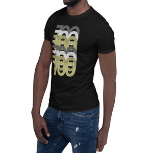 May include: A black short-sleeved t-shirt with a graphic design of the number 700 repeated in different shades of gray and gold.