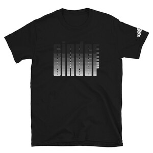 May include: Black short-sleeved t-shirt with a gradient design of the word "binder" in white.