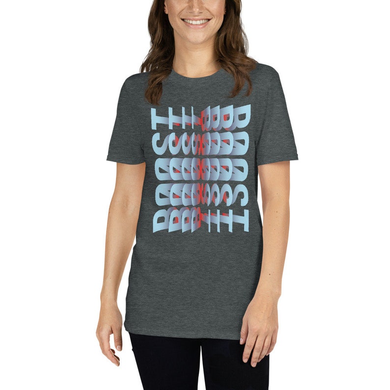 May include: A dark heather grey t-shirt with the words "The Good, The Bad, The Scruffy" printed in a blue and red 3D font.