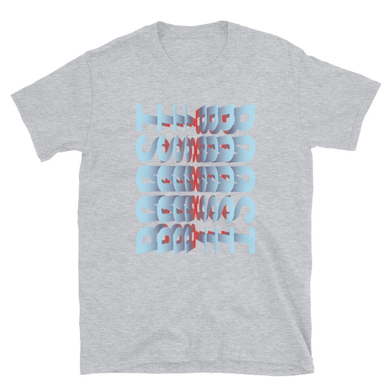 May include: A grey t-shirt with a blue and red graphic design that says "The Good, The Bad, The Ugly".