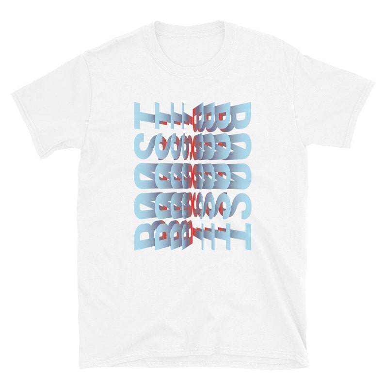 May include: White t-shirt with the text "The Best" printed in blue and red letters, with the letters stacked on top of each other and slightly offset.